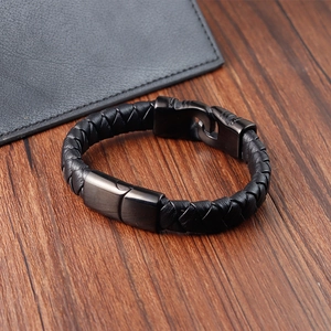 Men's black braided leather bracelet with matte black stainless steel buckle on wood
