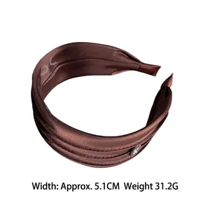 Wide chocolate brown satin pleated headband with a silver circular charm for daily wear