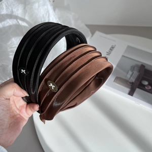 Elegant pleated wide headband set in black velvet and brown satin with metal bow accent