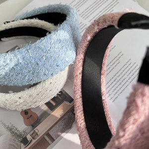 Three padded tweed headbands in blue, beige, and pink with sequins for volume