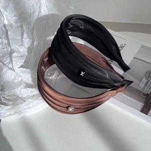 Elegant pleated satin wide headband in black and dark brown with decorative bow buckles