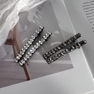 Elegant 4-piece Czech rhinestone hair clip set with sparkling crystals on black metal base