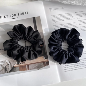 Classic black satin scrunchies in a set of two with a textured fabric finish