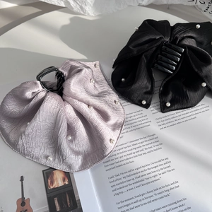 Elegant large bow hair claw with pearls on satin fabric in lavender and black colors