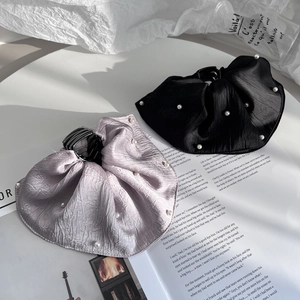 Elegant oversized pleated satin hair claw clip with pearl trim in black and lavender
