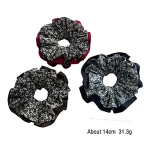 Set of three floral fabric scrunchies in navy, burgundy, and brown colors, 14cm diameter