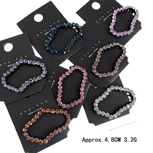 Set of seven sparkling rhinestone hair clips in multi-color cloud shapes for women