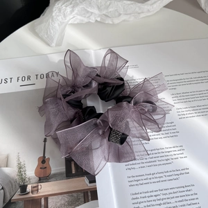 Elegant purple organza scrunchie with sparkling rhinestones and a mesh bow design