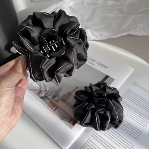 Elegant black satin flower hair claw clip with sparkling silver rhinestone edges for women