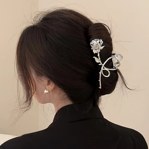 Elegant large silver rose hair claw clip for women shown on model hair back view
