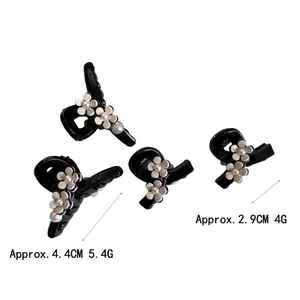 Elegant black acetate floral hair clips with pearls in 4.4cm and 2.9cm sizes