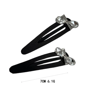 Elegant pair of 7cm black metal BB hair clips with sparkling crystal bow design