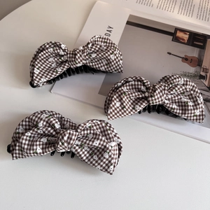 Korean style brown plaid floral bow banana hair clips on a minimalist white background