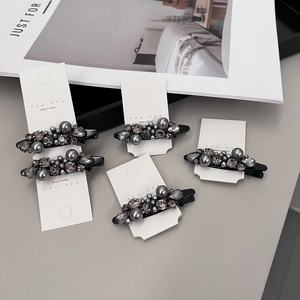 Chic 5-piece hair clip set with grey pearls and rhinestones on black duckbill clips