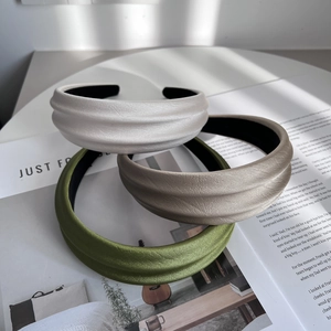 Three premium pleated padded headbands in white, champagne, and green colors