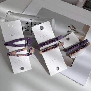 Purple rhinestone hair pin set with plaid fabric and metal 'Kitty' buckle on white cards