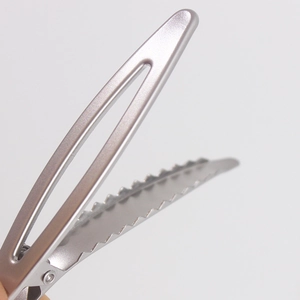 Matte silver alloy duckbill hair clip with hollow design and professional grip teeth