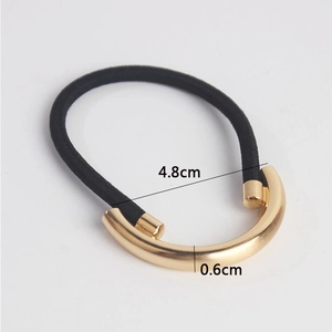 Detail shot of golden metal cuff hair tie showing 4.8cm diameter and 0.6cm thickness