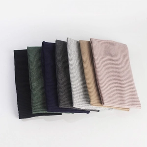 Detail showing various colors of ribbed knit elastic headbands for men and women