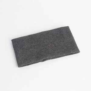 Detail of dark grey ribbed knit headband showing the textured elastic vertical stripe fabric