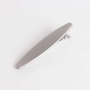 Detail view of the sleek matte silver alloy hair clip with a spring-loaded metal fastener