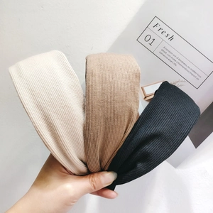 Three-pack ribbed knit headbands in beige brown and black colors for daily hair styling