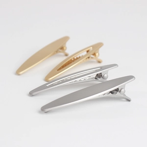 Matte gold and silver metal hair clips in solid and hollow rectangular minimalist style