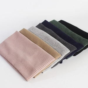 Elastic knitted headband for men and women in various solid colors with ribbed texture
