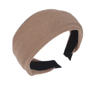 Brown padded knitted headband with thick vertical stripes and non-slip lining