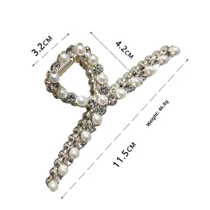 Detail of 11.5cm golden metal hair claw clip with pearls and rhinestones size specs