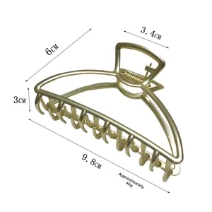 Detailed view of the 9.8cm matte gold alloy hair claw clip with its multi-tooth structure