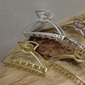 Set of four large geometric alloy hair claws in gold and silver finishes for women