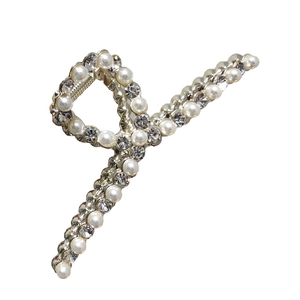 Elegant silver metal hair claw clip with crossing white pearls and rhinestones design