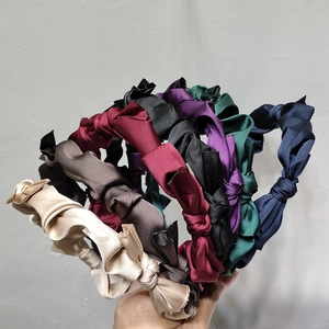 Elegant satin twist headband set in multiple colors including beige, burgundy and navy blue