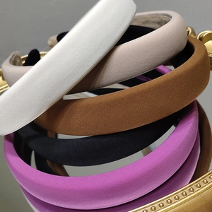 French style padded sponge headband in solid fabric colors shown from a high angle view