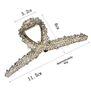 Detailed view of gold pearl hair claw clip with size dimensions and weight info
