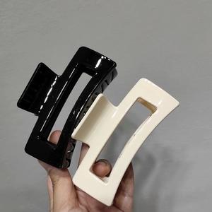 Rectangle hollow hair claws in black and beige cream colors for French style updos