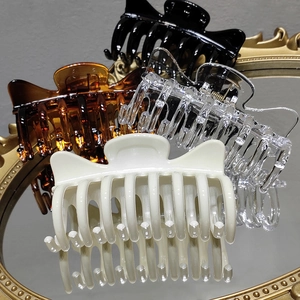 Elegant cat-ear hair claws set in cream, transparent, tortoiseshell and black colors