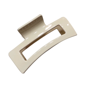 Elegant cream rectangular hollow hair claw clip with glossy finish for French style hair