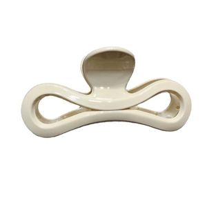 Pince à cheveux élégante blanc ivoire en résine brillante avec design nœud infini