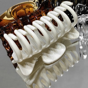 Detailed set of large claw clips in cream, amber, black and transparent acrylic finish