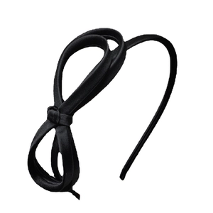 Elegant black satin headband with artistic knot design and silk texture on white background