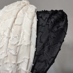 Elegant wide French headband set in cream and black featuring a 3D textured jacquard fabric