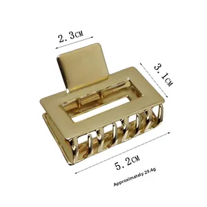 Detailed dimensions of a small golden rectangular metal hair claw clip with mirror finish
