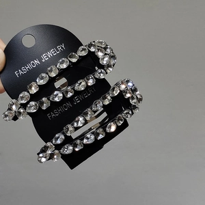 Elegant set of two black hair clips with sparkling white crystals for women hair styling