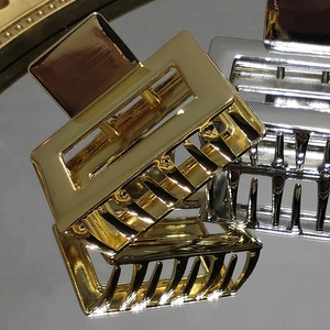 Minimalist rectangular gold and silver metal hair claws with glossy mirror finish