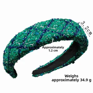 Detail shot of green tweed sponge headband with sequins measuring 3.2cm in width