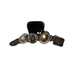 Elegant black hair claw clip with golden camellia charm and pearl rhinestone accents
