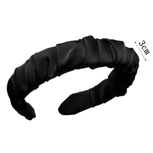 Detail view of 3cm wide black pleated satin headband showing rich texture and cloud design
