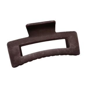 Close-up of a large dark brown flocked hair claw clip with a strong metal spring mechanism